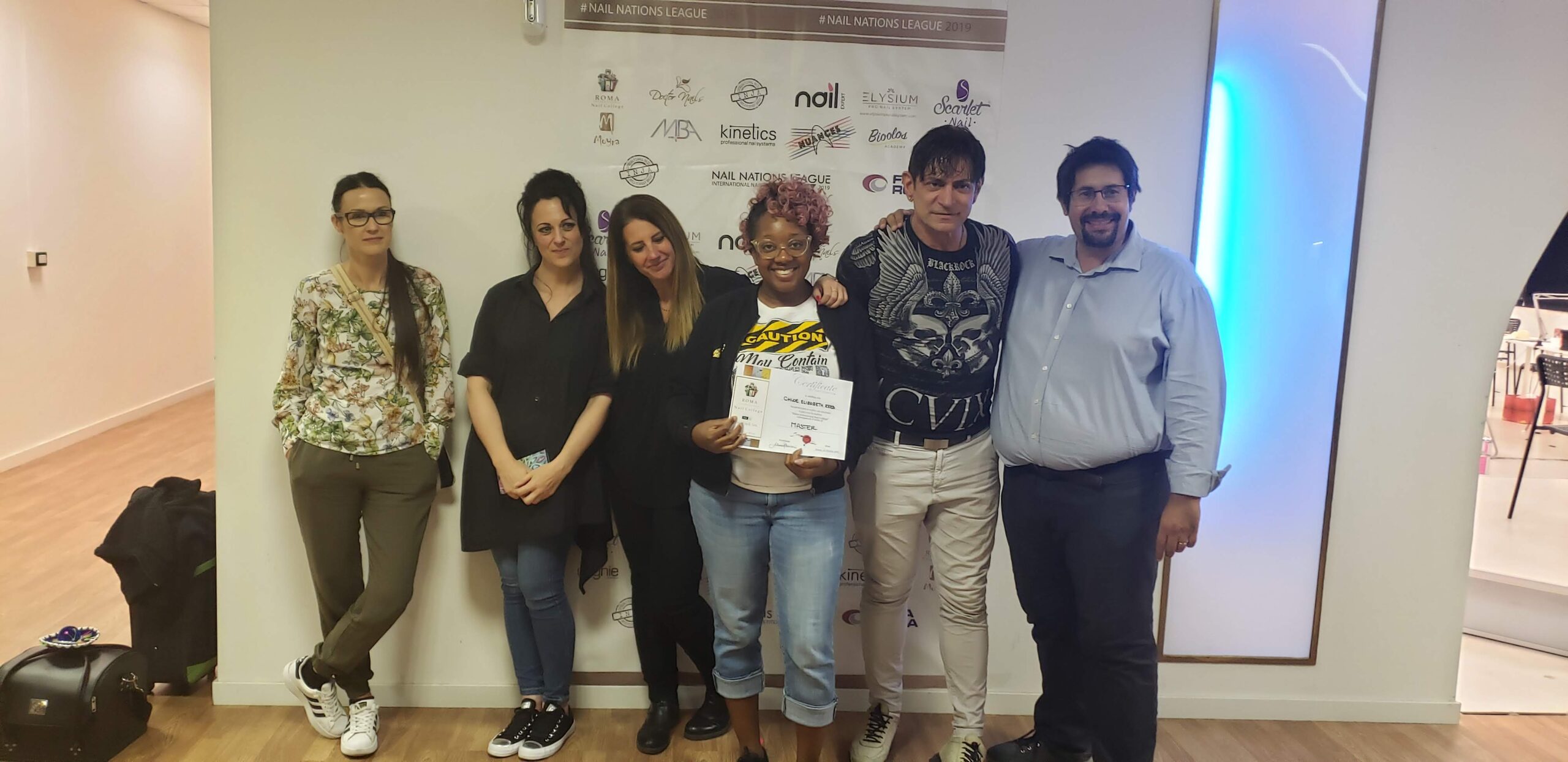 Chloe at a nail training class in Italy